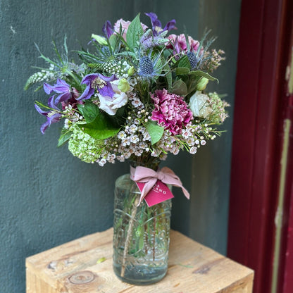 Bottle with Seasonal Flowers