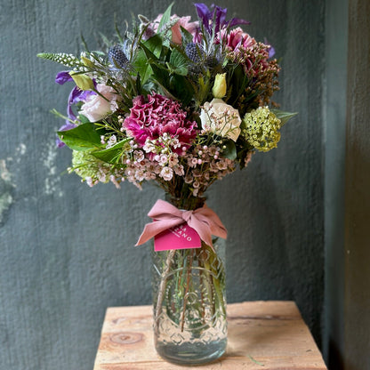 Bottle with Seasonal Flowers